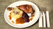 Crispy goose legs, mashed potatoes with onions, stewed cabbage