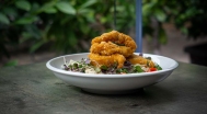 Sesame chicken breast strips, green salad, garlic dressing, croutons