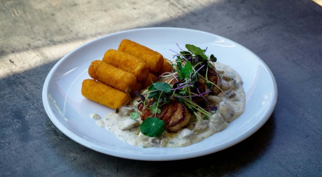 Pork tenderloin medallions wrapped in bacon, creamy mushroom sauce, croquettes 