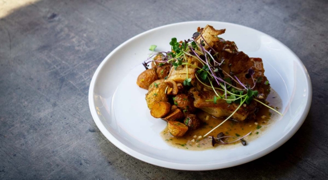 Hungarian pork roast with confit pork neck, crispy pork fat, and potato wedges 