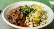 Lamb stew with wild garlic dumplings and homemade pickles
